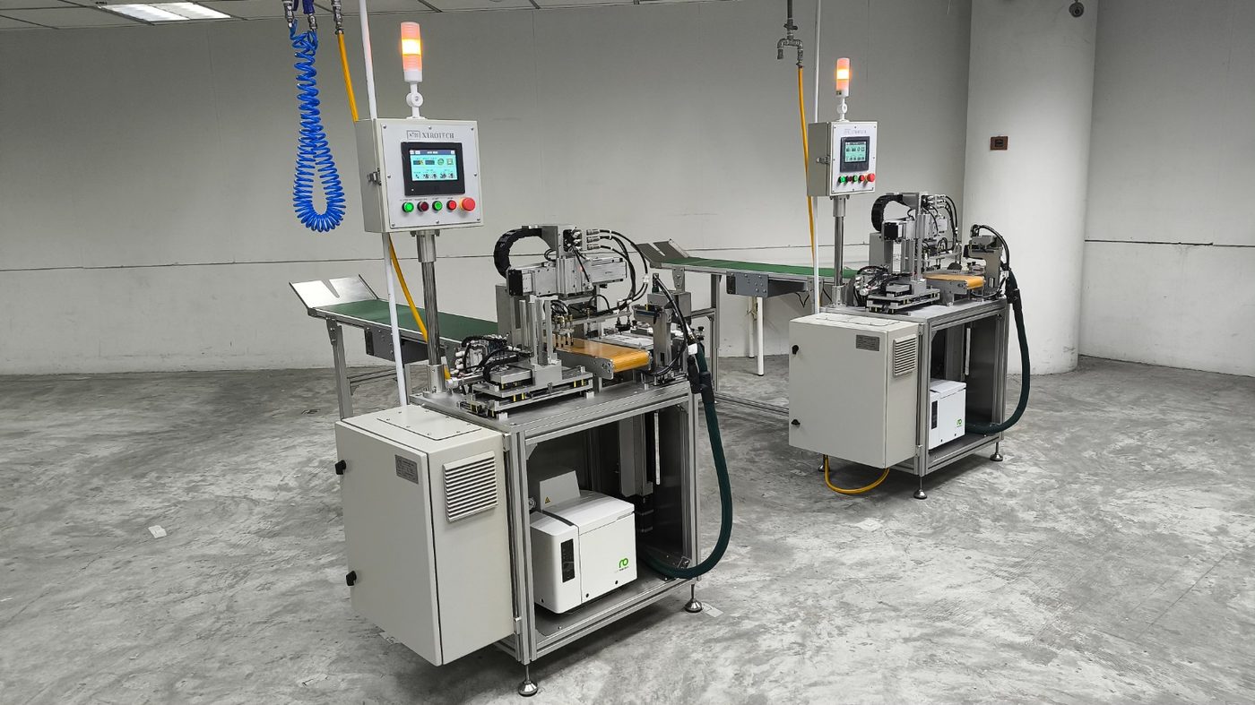 Two custom automation stations with conveyor transfer, designed, built and commissioned by Xtrotech
